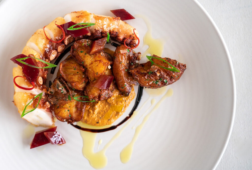 olive brined grilled octopus with crispy fried potatoes