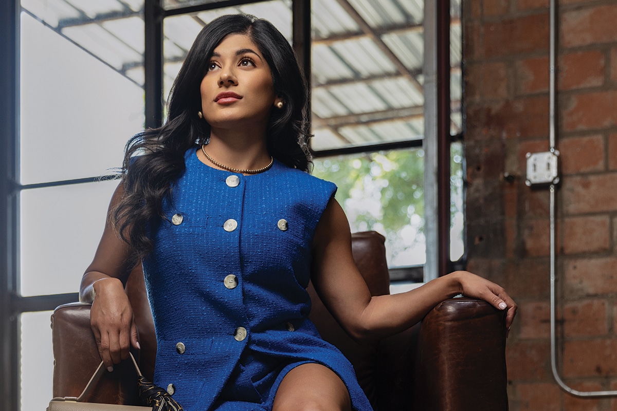 Model in blue suit sitting