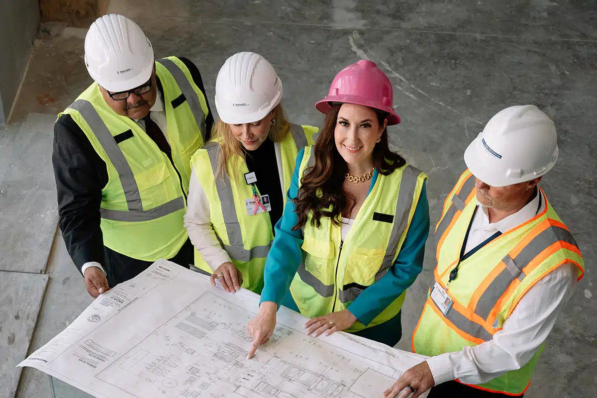 Megan Amalakuhan with construction team Megan Amalakuhan with construction team
