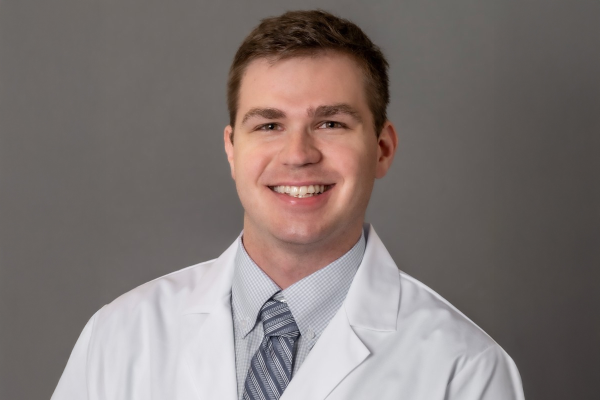 Christian Boudreaux PA C photo of man in white coat